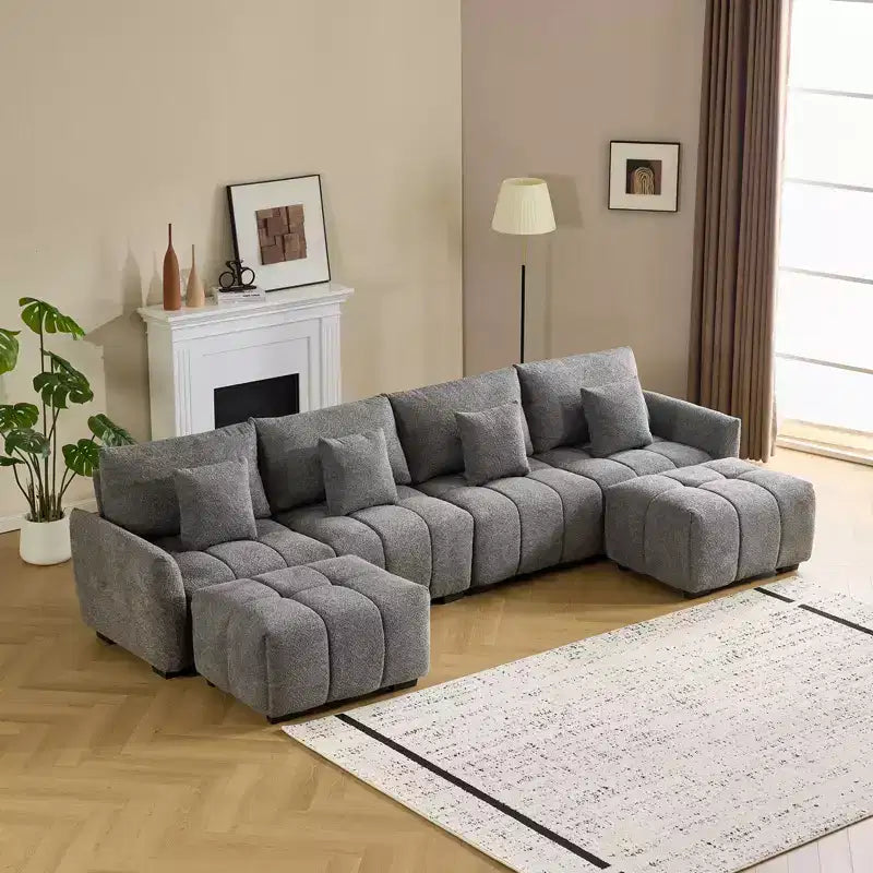 Divano a L americano trapuntato 355 cm larghezza, con bracciolo tondo, in bouclé verde e ottomana