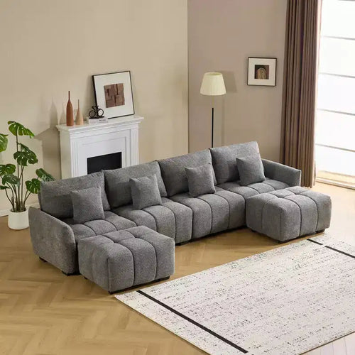 Divano a L americano trapuntato 355 cm larghezza, con bracciolo tondo, in bouclé verde e ottomana